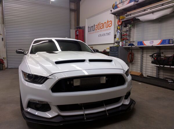 Ford Mustang GT front view showing professional dark window tint by Tint Philadelphia