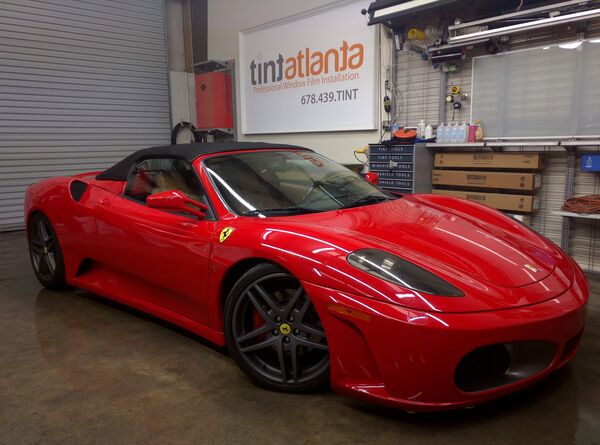 Red Ferrari F430 Spider convertible with premium window film at Tint Philadelphia shop