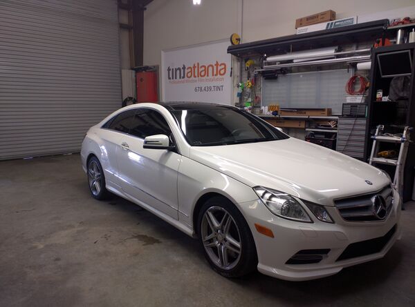 White Mercedes-Benz E-Class Coupe with professional window tinting Philadelphia