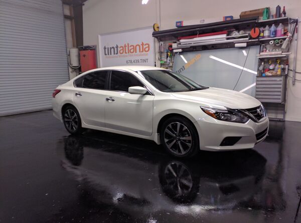 White Nissan Altima sedan with window tint installation Tint Philadelphia