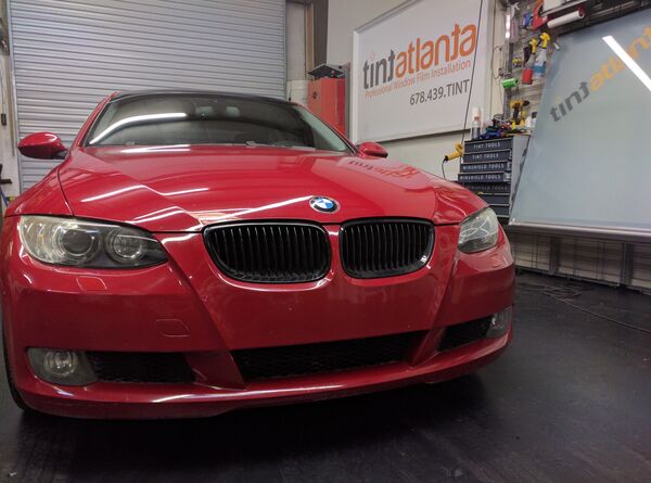 Red BMW Coupe front view with dark window tint by Tint Philadelphia
